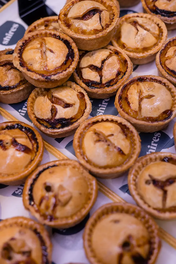 A tray of golden pies
