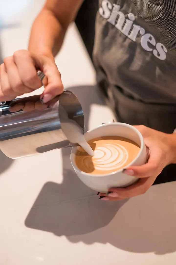 Latte art being poured
